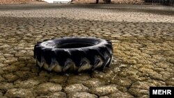 A tire lies on a dried-up section of Lake Urmia in northwestern Iran.