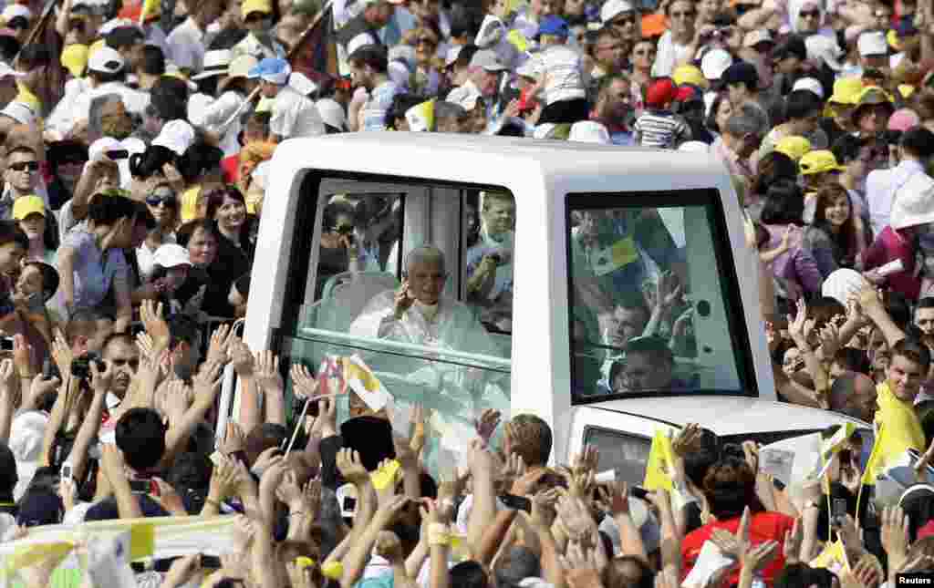 Pope Benedict waves as he arrives to lead a solemn mass in Zagreb, Croatia, on June 5, 2011.