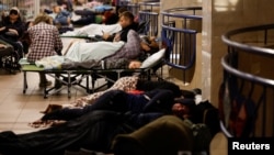 People are hiding inside the metro station during rocket attack and drone of drone in Kiev, August 28, 2025