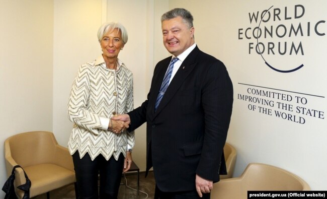 Президент України Петро Порошенко і директор-розпорядник МВФ Крістін Лаґард. Давос, 23 січня 2019 року