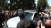 Armenia - Masked officers of the National Security Service are confronted by angry followers of the Armenian Apostolic Church in Echmiadzin, June 27, 2025.