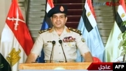 Egyptian Defense Minister Abdel Fattah al-Sisi announces the army's road map for Egypt's political future on state television on July 3.