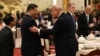 Chinese leader Xi Jinping and US President Donald Trump shake hands as they attend a state banquet at the Great Hall of the People in Beijing on May 14.