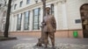 Belarus - Riot police patrols statue. Minsk, 24Mar2017