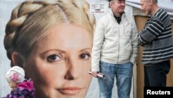 Supporters of jailed former Prime Minister Yulia Tymoshenko chat in a protest tent camp in central Kyiv on October 7.