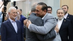 Iranian President Masud Pezeshkian greets Pakistani Field Marshal Asim Munir (right) in Tehran as part of the army chief's war-mediation efforts. (See item below)