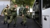 Russian recruits take a bus near a military recruitment center in Krasnodar, Russia. President Vladimir Putin has eased the paperwork and offered other incentives to swell the ranks of his military forces with foreigners.