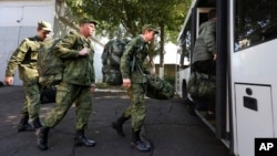 Russian recruits board a bus near a military recruitment center in Krasnodar, Russia, on September 25, 2022.