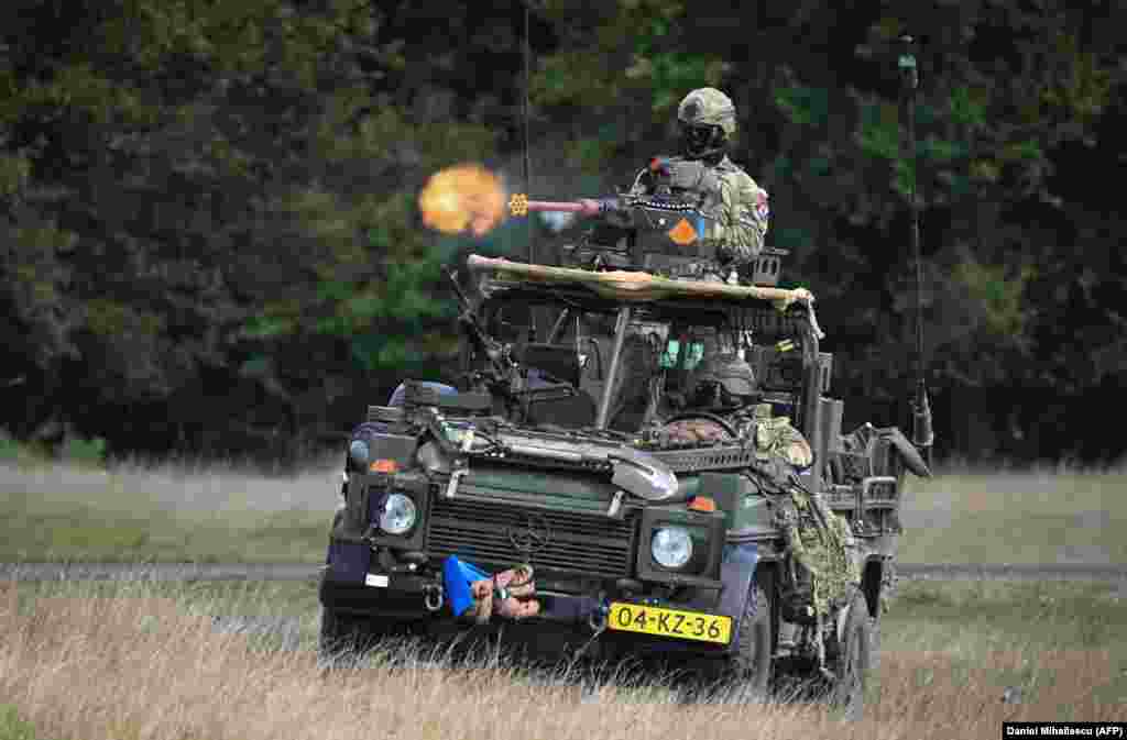 Dutch soldiers fire a dummy weapon during a NATO exercise at Cincu on September 20. The relocation of the NATO battle group in Romania was scheduled to be done in June. It is unclear what has caused the delay in the move.