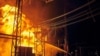 Харків, 11 вересня 2022 року. Рятувальники гасять пожежу на електричній підстанції, що виникла після російського обстрілу інфраструктури міста 