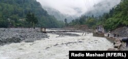 The raging waters of the Bishigram River amid torrential monsoon rains this year.