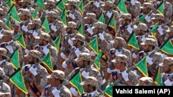 Islamic Revolutionary Guard Corps troops march during a military parade outside Tehran.