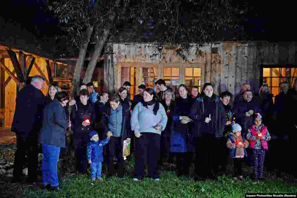 These Romanians gathered on September 18 to mourn the death of Queen Elizabeth II in the yard of a property in Viscri, Romania. &nbsp;