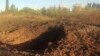 A photo provided by the Pivdennoukrayinsk (South Ukraine) Nuclear Power Plant shows a crater left by a Russian rocket is seen 300 meters from the plant on September 19.