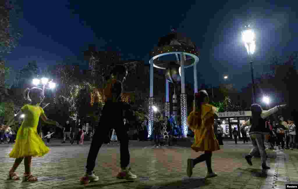 The Baikonur Cosmodrome in Kazakhstan, which dates from 1955 and was built by the Soviet Union, is the world&#39;s oldest spaceport for orbital launches. In the town of Baikonur, girls dance around the monument to the Soyuz rocket on September 17.