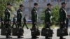 Army conscripts line up at the Yegorshino regional assembly station before departing for service with the Russian Army.