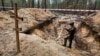 Lângă orașul Izium, după eliberarea de armata rusă, au fost descoperite gropi comune, 15 septembrie 2022