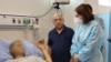 Armenian Health Minister Anahit Avanesian (right) visits civilians wounded by Azerbaijani shelling on September 14. 