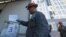 A construction worker casts his ballot during a referendum on joining Russia in Sevastopol, Crimea, on September 26.