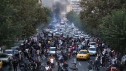 Iranian demonstrators take to the streets of the capital Tehran in September 2022 during a protest for Mahsa Amini, days after she died in police custody.