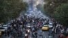 Iranian demonstrators take to the streets of the capital, Tehran, during a protest for Mahsa Amini, days after she died in police custody.