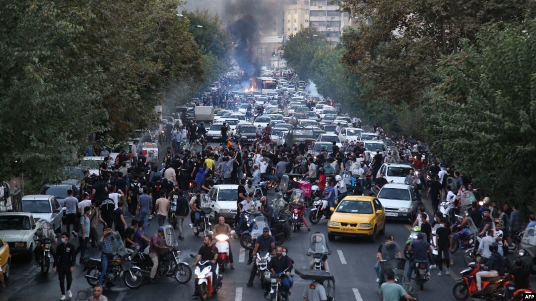 Iranian demonstrators take to the streets of the capital, Tehran, during a protest for Mahsa Amini, days after she died in police custody.