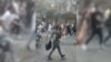 WATCH: Protesters chased police officers in the northwestern Iranian city of Tabriz on September 20 as nationwide protests continued over the death of a 22-year-old woman who was detained by the country's morality police.