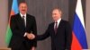 Президенты Азербайджана и России - Ильхам Алиев (слева) и Владимир Путин 