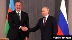 Президенты Азербайджана и России - Ильхам Алиев (слева) и Владимир Путин 