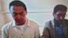 Кайрат Сатыбалды (слева) и его адвокат во время судебного заседания 20 сентября 2022 года