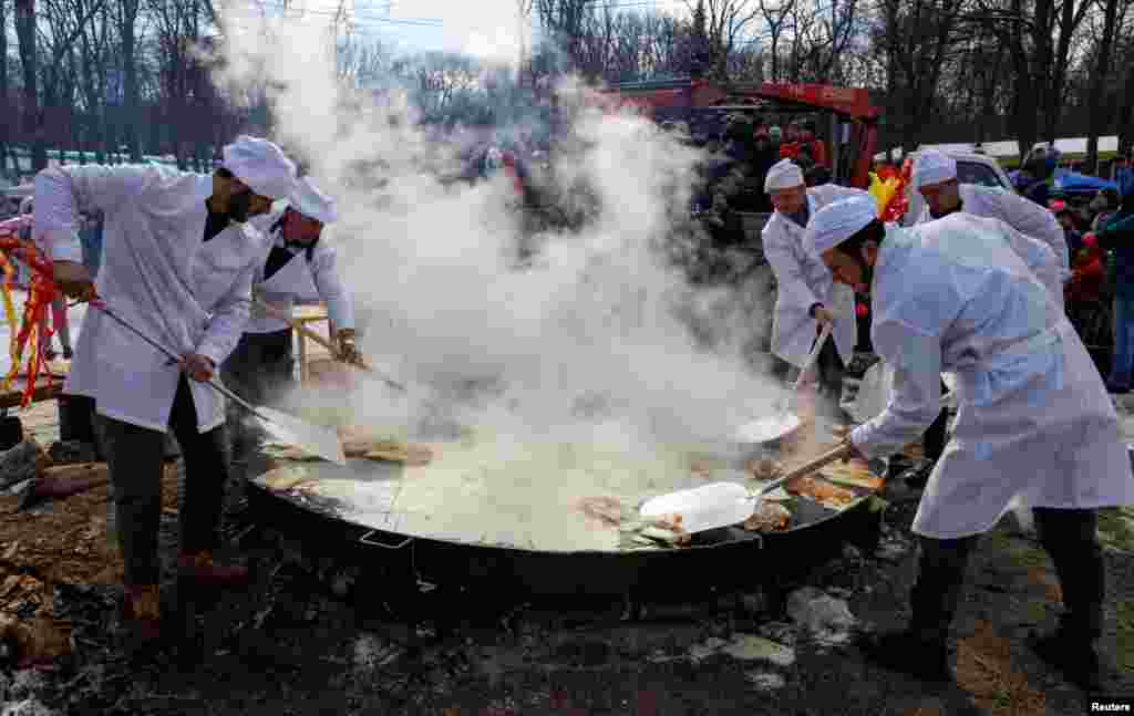 Pancakes being flipped in Moscow on February 26. Warm, golden pancakes recall spring sunshine --&nbsp;and are the Maslenitsa food of choice.&nbsp;