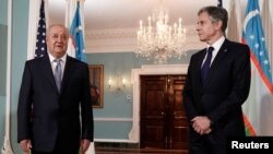 Uzbek Foreign Minister Abdulaziz Kamilov (left) and U.S. Secretary of State Antony Blinken face reporters as they meet at the State Department in Washington on July 1.