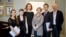 Composer Anthony Bolton (right); Olivia Ray (third from left), who plays the role of Anna Politkovskaya; Marina Litvinenko (third from right), Aleksandr Litvinenko's widow; and musicians pose for a photo during the press launch of the opera in London on February 24.