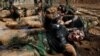 Members of Kurdish Peshmerga special forces demonstrate their skills during their graduation ceremony at a military camp in Iraqi Kurdistan. (Reuters/Azad Lashkari)