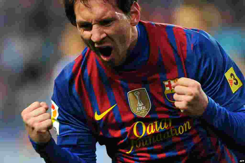 Barcelona's Argentinian forward Lionel Messi celebrates after scoring during a Spanish league football match against Malaga in January. Messi went on to beat Gerd Muller's 40-year-old record for the most goals scored in a calendar year. Messi ended the year with 91 goals.