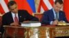 U.S. President Barack Obama (left) and his Russian counterpart, Dmitry Medvedev, sign the New START treaty in Prague on April 8, 2010.