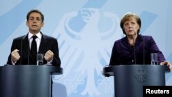 Nicolas Sarkozy və Angela Merkel