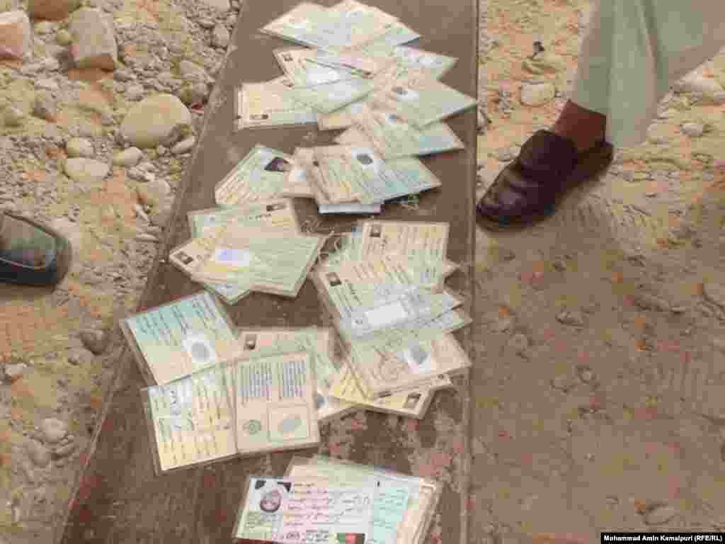 There have been reports of irregularities. These fake voting cards were seized in Helmand Province.