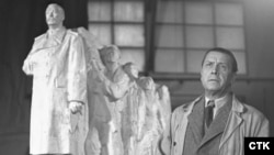 Sculptor Otakar Svec stands with the model of his giant Stalin memorial in 1953.