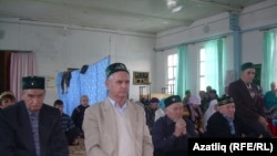 Russia -- Khusain Khasanov (in the middle) during the pray in the mosque, Kargaly village, Orenburg region, undated