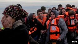 Refugees and migrants arrive by dinghy from Turkey to the coast of Mytilini, on the island of Lesbos, on February 17.