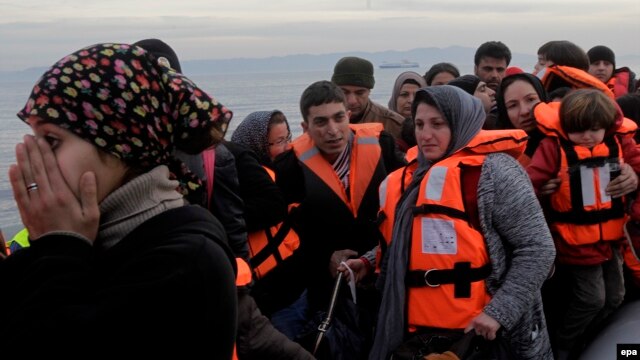 Refugees and migrants arrive by dinghy from Turkey on the Greek island of Lesbos in February. Despite Ankara's crackdown on such transports, people smugglers are confident that it won't have too much of an adverse impact on their trade. 
