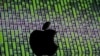 A 3D printed Apple logo is seen in front of a displayed cyber code - generic