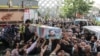 Mourners carry the coffin of Colonel Hassan Sayad Khodaei from Iran's Islamic Revolutionary Guards Corps, who was killed in Tehran on May 22. 