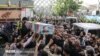 The killing of Ali Esmailzadeh took place within two weeks of the May 22 assassination in Tehran of fellow IRGC member Colonel Hassan Sayad Khodaei, whose funeral procession is pictured here. 