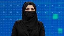 Thamina Usmani, a female presenter for Tolo News, covers her face in a live broadcast at the Tolo TV station in Kabul. (file photo)