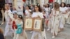 Locals of Ruse in northern Bulgaria wear gowns featuring Cyrillic characters.&nbsp;<br />
<br />
Bulgarians turned out en masse on May 24 to honor the legacy of Saints Cyril and Methodius during a holiday named after the two brothers.