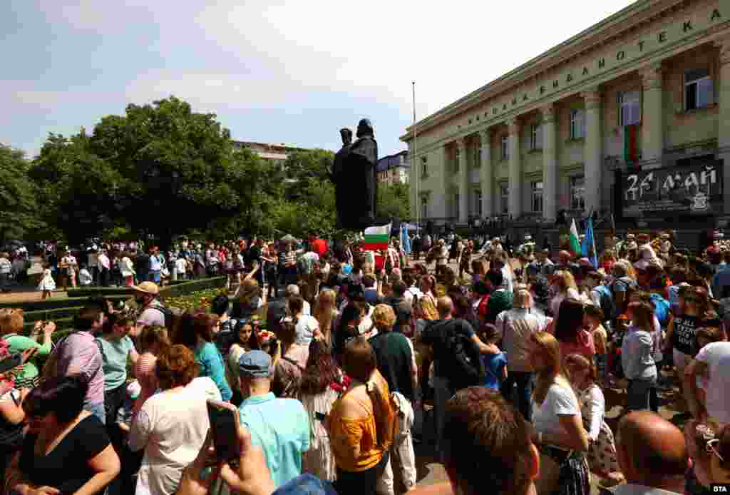 People gather to lay flowers at the base of a statue to Cyril and Methodius in central Sofia on May 24. The saints were born in today&#39;s Greece in the 9th century and are credited with creating an alphabet for the Slavic people that was later adapted during the first Bulgarian Empire to become the Cyrillic script.