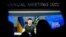 Ukrainian President Volodymyr Zelenskiy is seen on a screen as he delivers a video address to the delegates of the World Economic Forum in Davos on May 23.