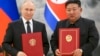 Ruski predsjednik Vladimir Putin (lijevo) i sjevernokorejski lider Kim Jong Un tokom ceremonije potpisivanja novog partnerstva u Pjongjangu, Sjeverna Koreja, 19. juna 2024.